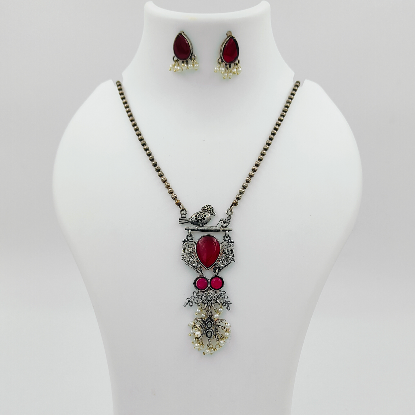 Enchanting Bird Maroon Plated Stone Studded Jewellery Set