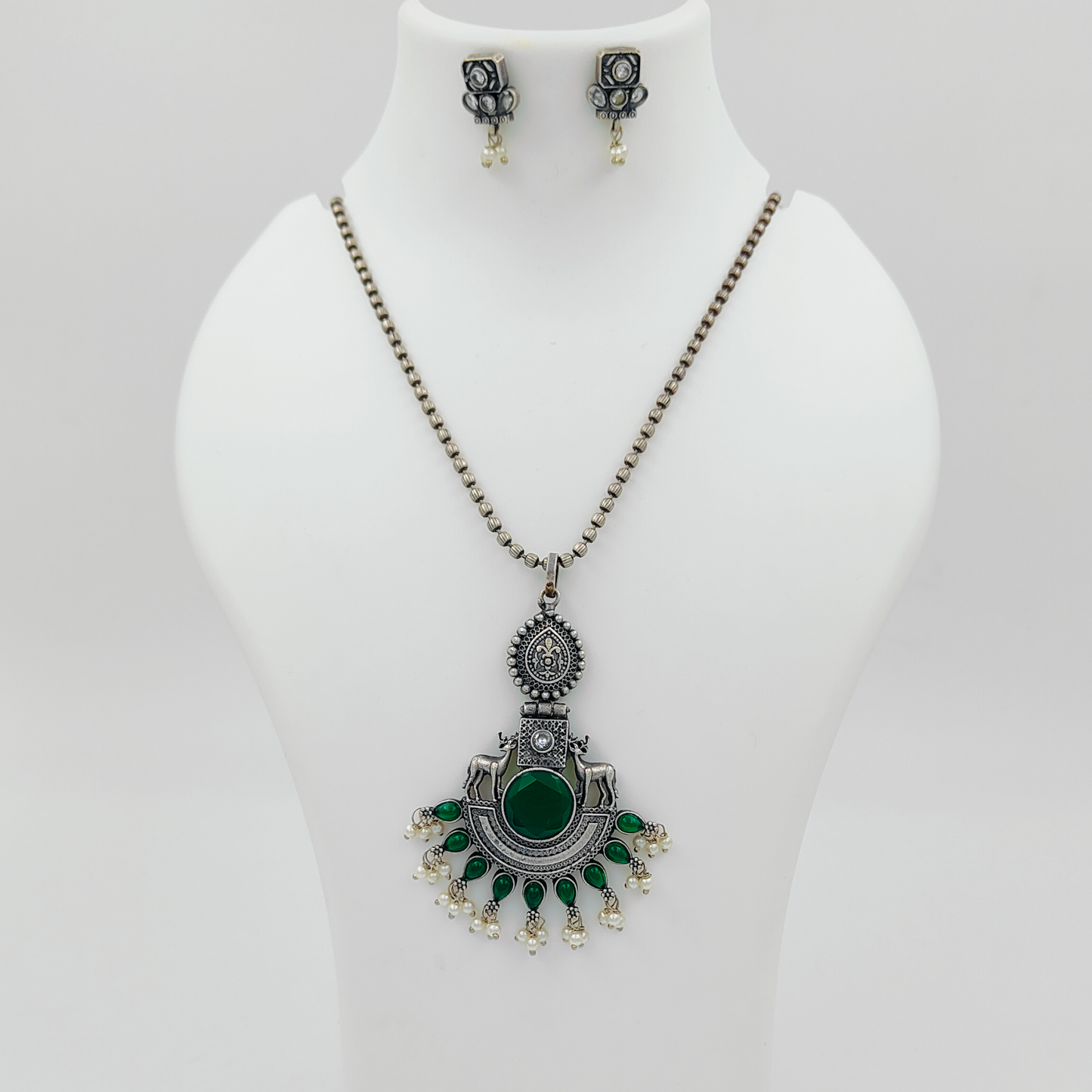 Enchanting Deer Emerald Silver Plated Stone Studded Jewellery Set